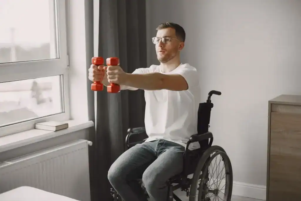 Image of man doing exercise in his wheelchair to aid weight loss Cambridgeshire